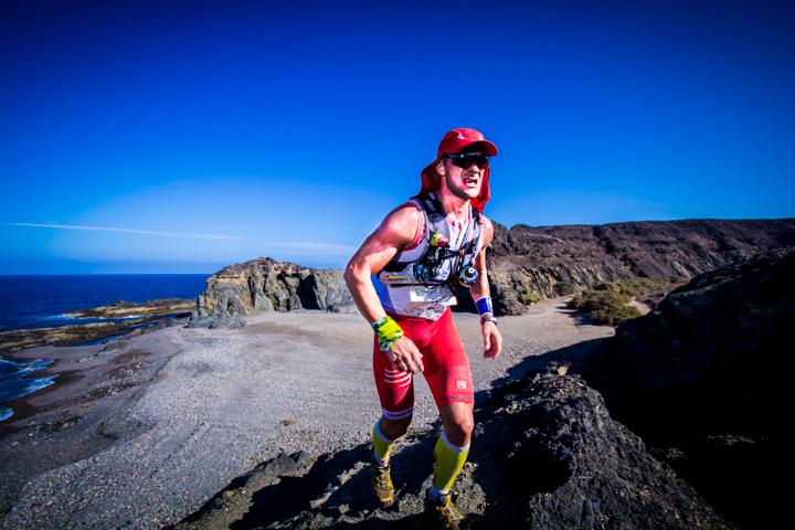 Fuerteventura Coast2Coast runner on a volcanic trail beside the sea