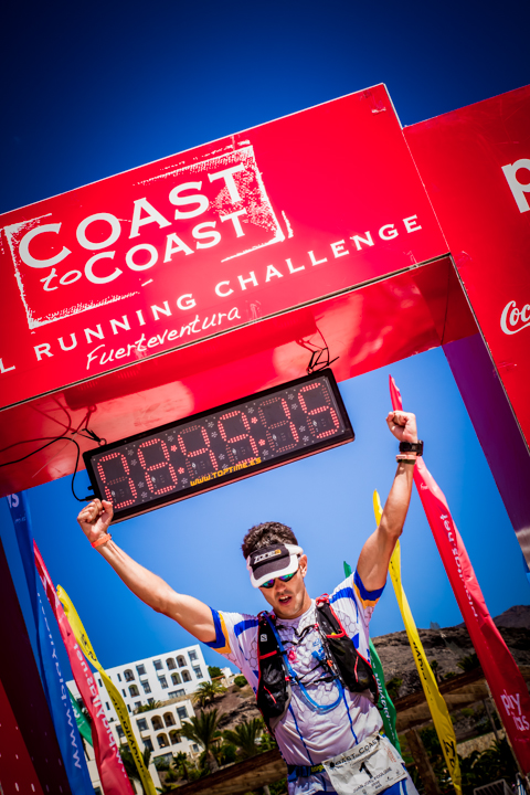 Runner celebrating at the Fuerteventura Coast2Coast finish line